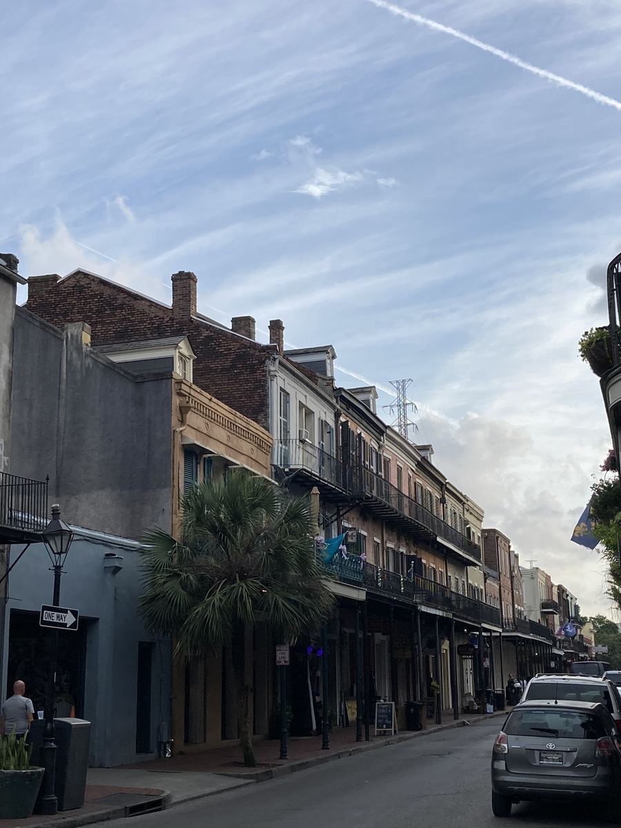 Historic ironwork balconies along a French Quarter street in New Orleans